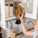 female organizing pantry